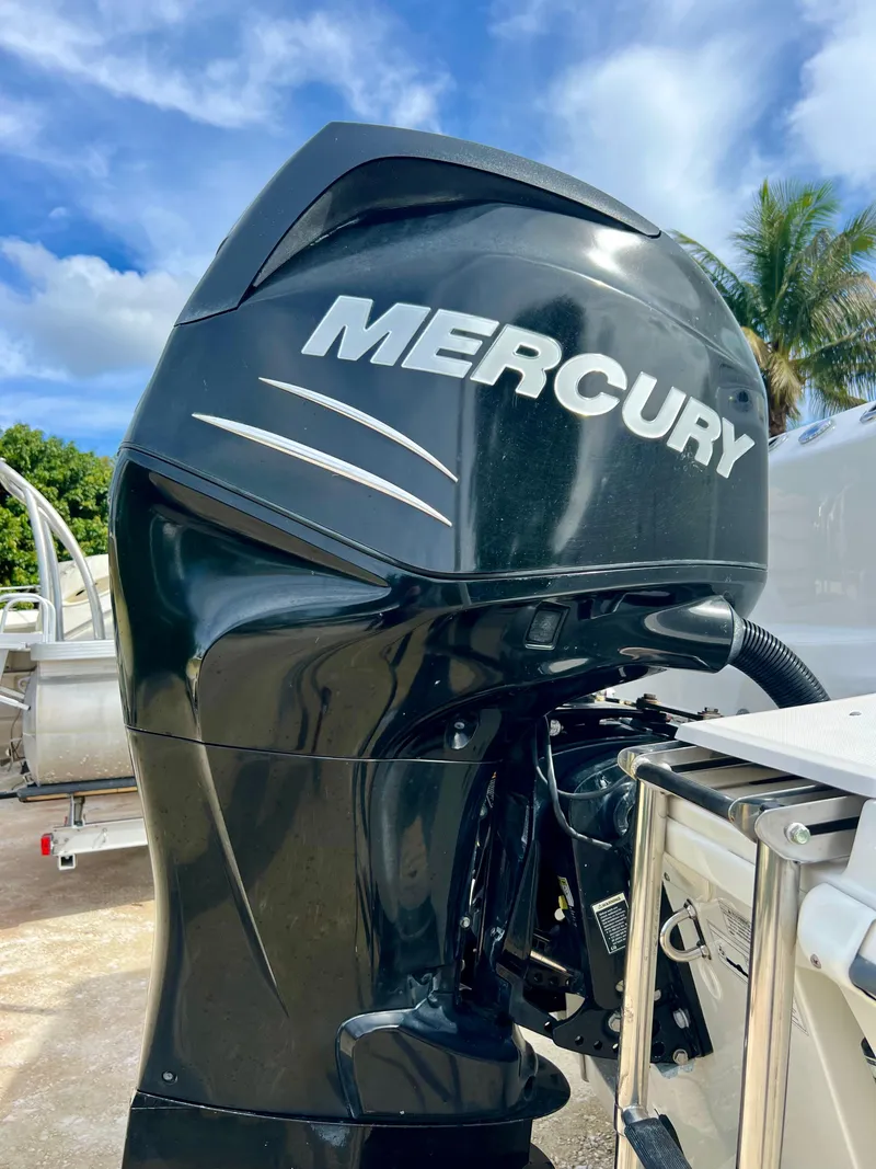 Slide: The Image of Mercury outboard motor on a 2015 Boston Whaler 250 Outrage boat. - 47
