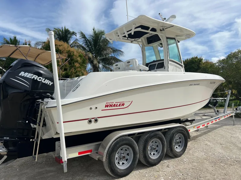 Slide: The Image of 2015 Boston Whaler 250 Outrage boat on a trailer with Mercury engine. - 7