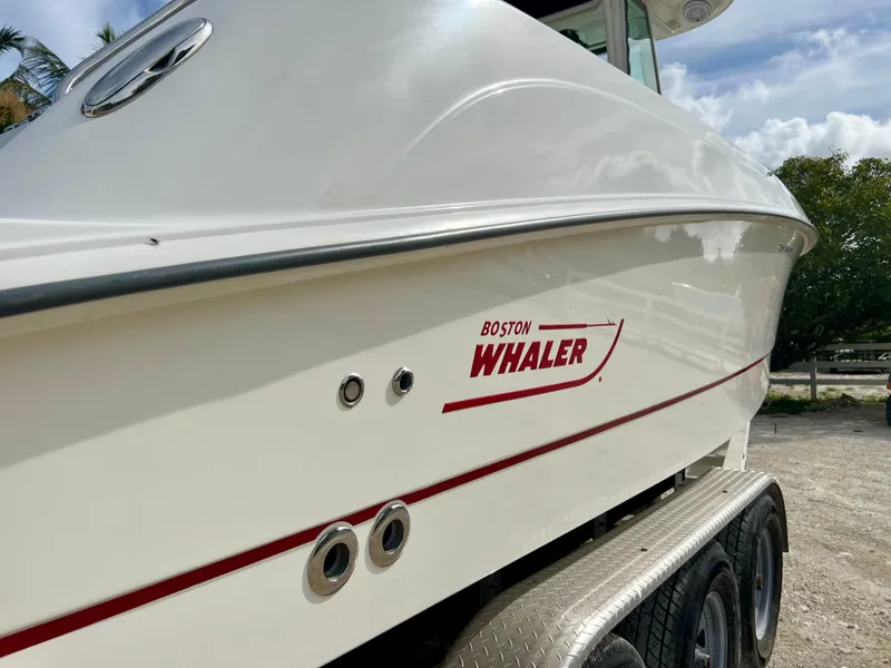 Slide: The Image of 2015 Boston Whaler 250 Outrage boat on a trailer, side view. - 8