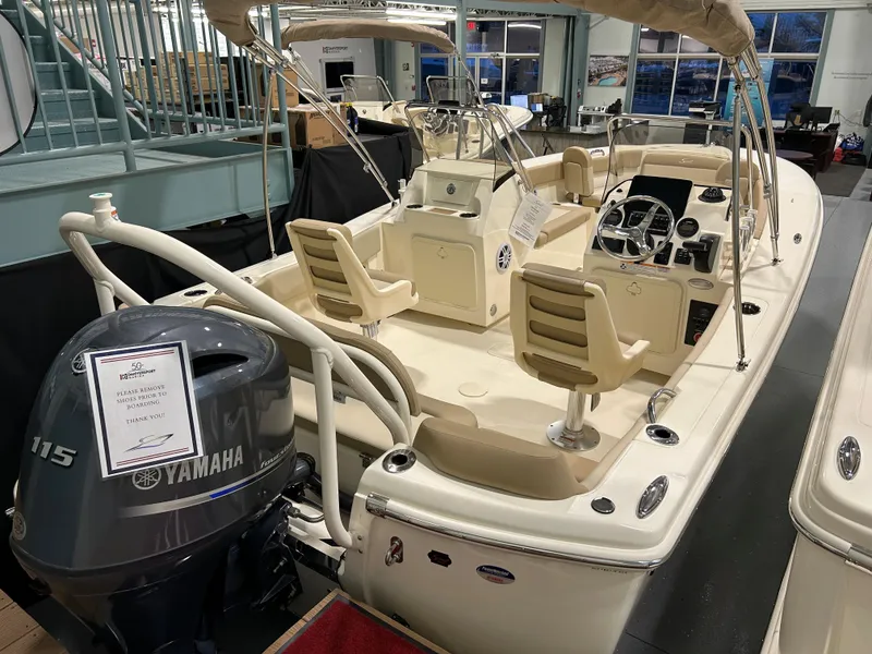 Slide: The Image of 2024 Scout 195 Dorado boat with Yamaha 115 outboard motor in showroom. - 0