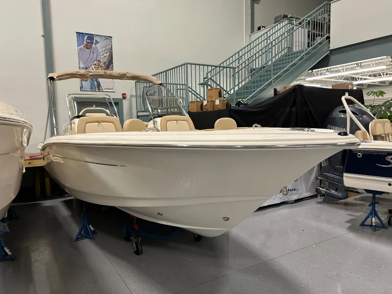 Slide: The Image of 2024 Scout 195 Dorado boat displayed indoors. - 1