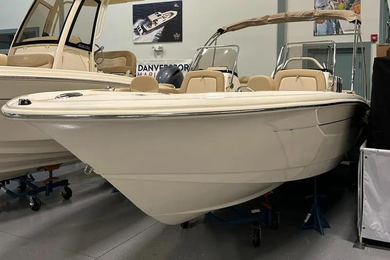 Slide: The Image of 2024 Scout 195 Dorado boat on display in showroom. - 2