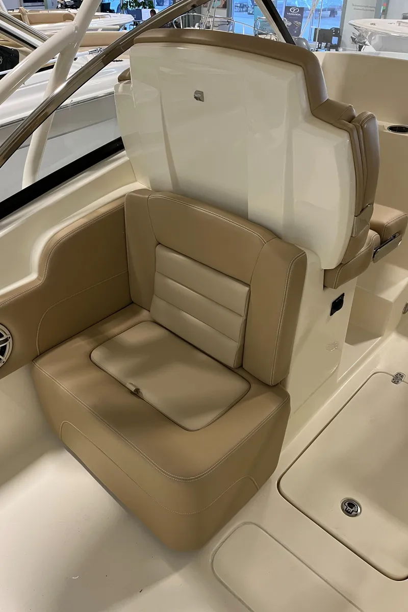 Slide: The Image of 2024 Scout 255 Dorado boat interior with tan leather seating. - 10