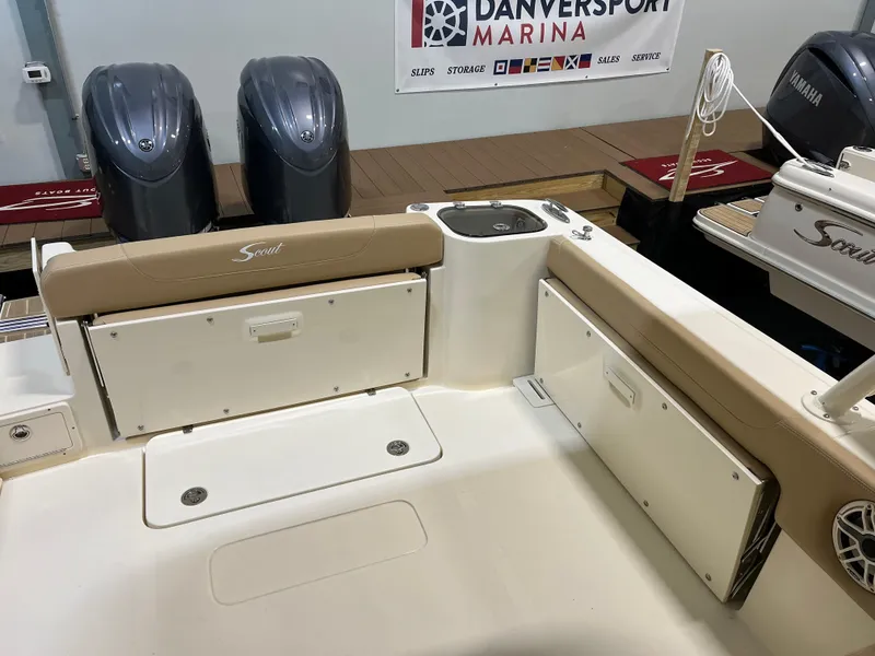 Slide: The Image of 2024 Scout 255 Dorado boat interior at Danversport Marina with twin outboard engines. - 3