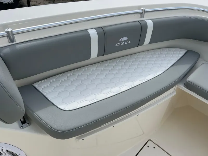 Slide: The Image of 2014 Cobia 296 Center Console boat with cushioned seating. - 15