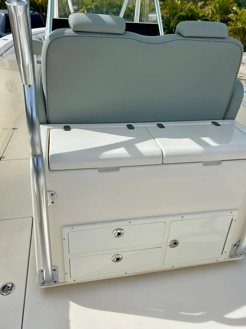 Slide: The Image of 2014 Cobia 296 Center Console boat seating and storage compartments. - 21