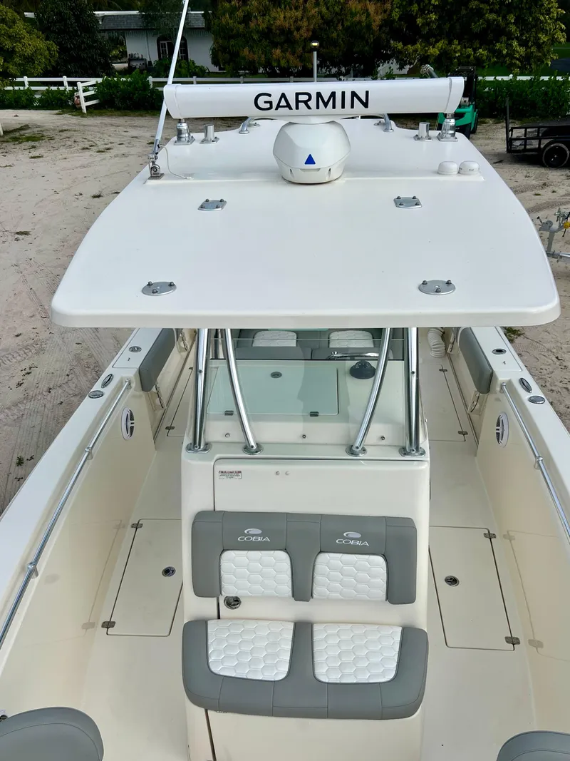 Slide: The Image of 2014 Cobia 296 Center Console boat with Garmin electronics. - 25
