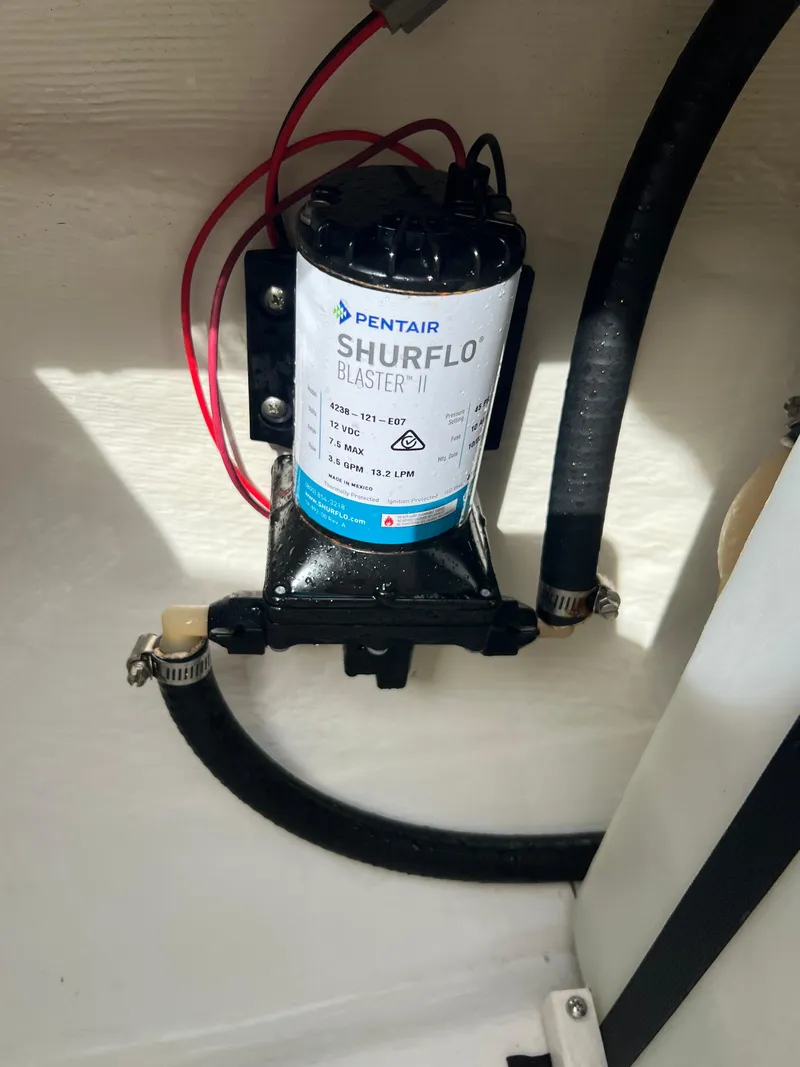 Slide: The Image of Pentair Shurflo Blaster II pump in a 2014 Cobia 296 Center Console boat. - 32