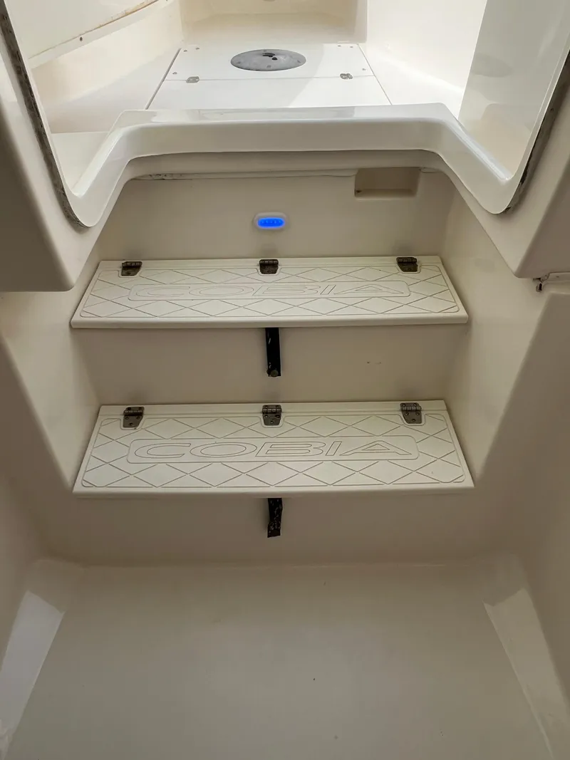 Slide: The Image of 2014 Cobia 296 Center Console boat interior steps with non-slip surface. - 35