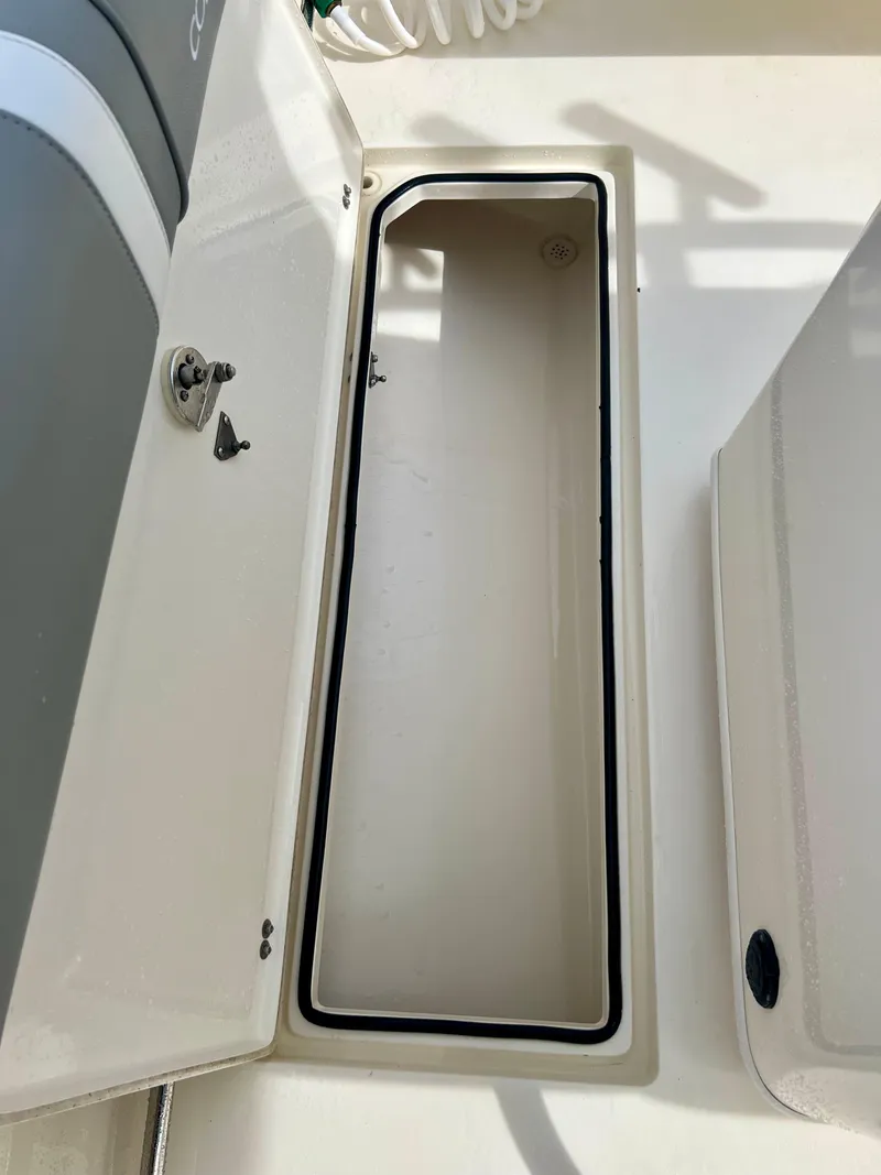 Slide: The Image of 2014 Cobia 296 Center Console storage compartment. - 38