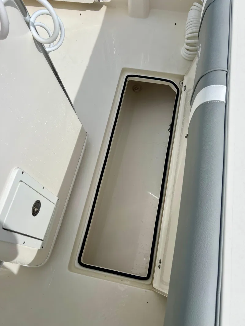 Slide: The Image of 2014 Cobia 296 Center Console boat storage compartment. - 39