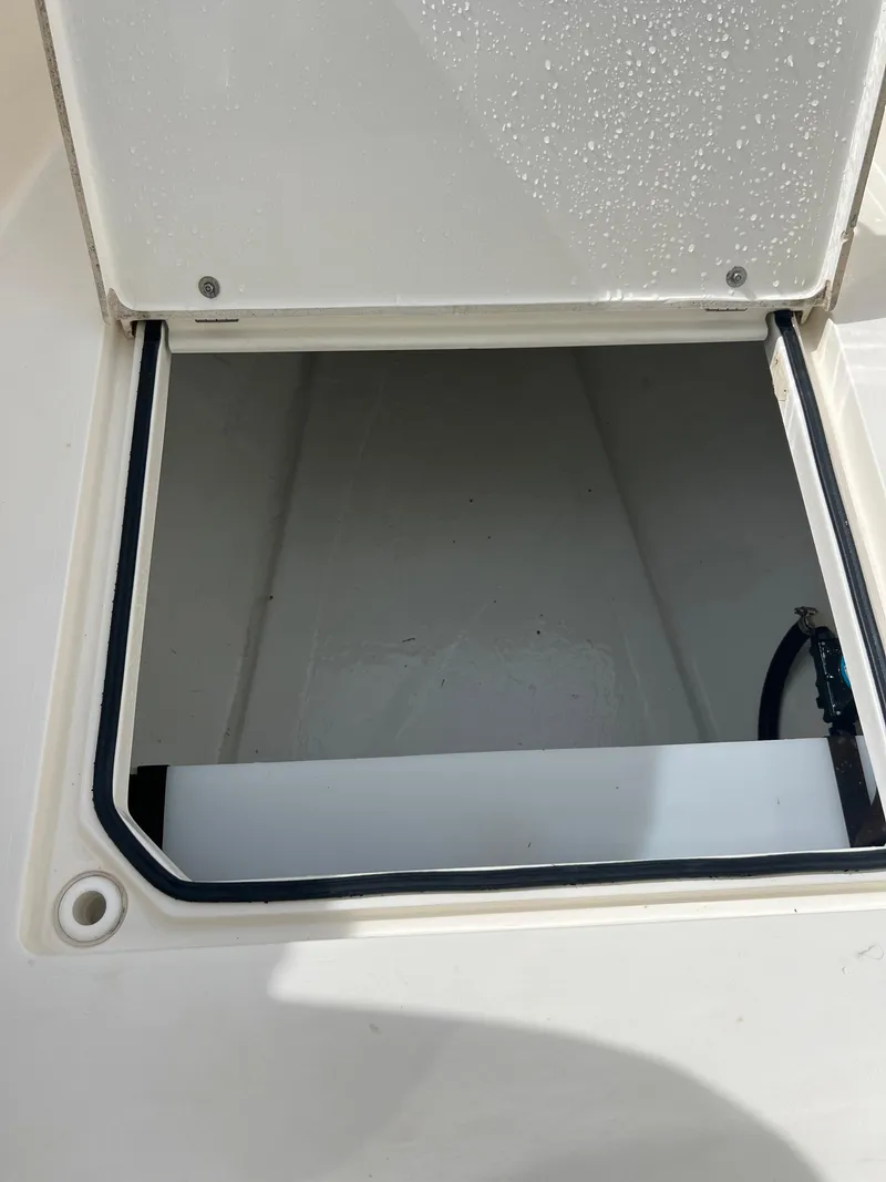 Slide: The Image of 2014 Cobia 296 Center Console storage compartment. - 42