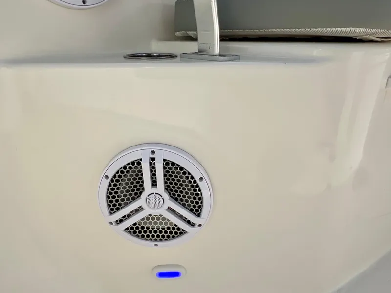 Slide: The Image of Close-up of a 2014 Cobia 296 Center Console boat speaker and seating area. - 44