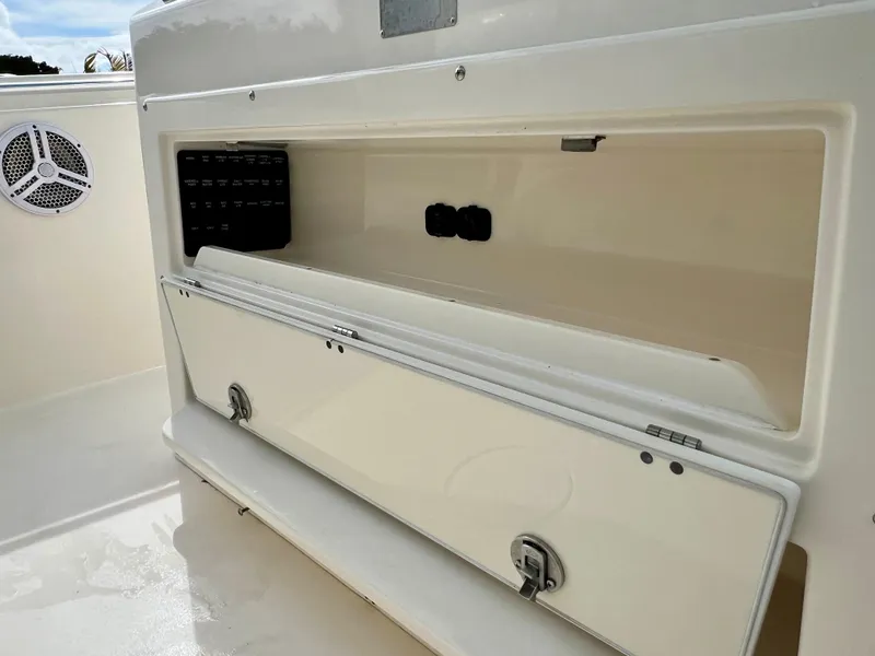Slide: The Image of 2014 Cobia 296 Center Console storage compartment with open hatch. - 45