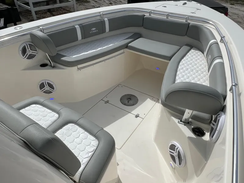 Slide: The Image of 2014 Cobia 296 Center Console boat with spacious seating and modern design. - 47