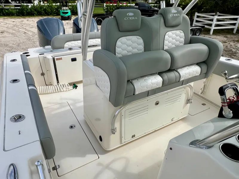 Slide: The Image of 2014 Cobia 296 Center Console boat with dual seating and storage. - 48