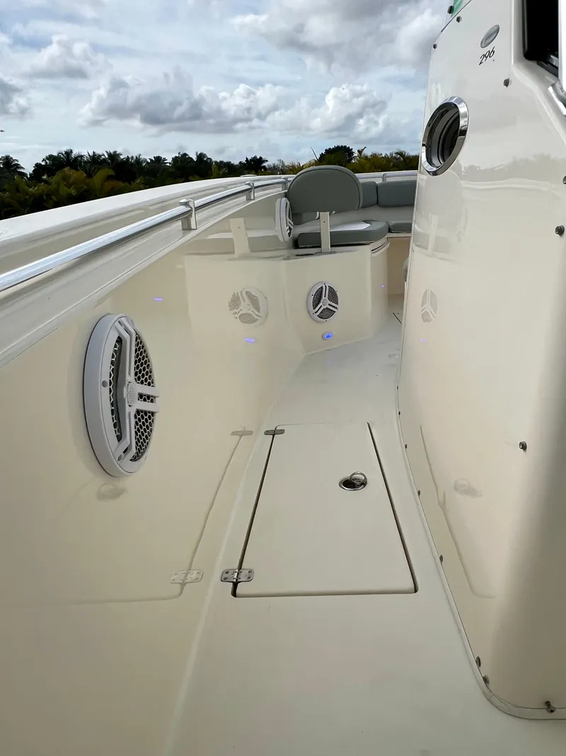 Slide: The Image of 2014 Cobia 296 Center Console boat deck with speakers and seating. - 49