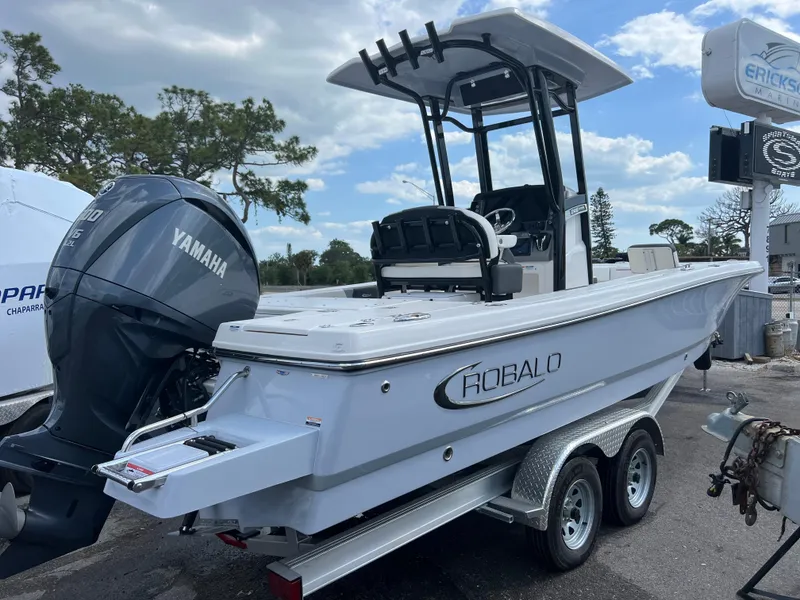 Slide: The Image of 2024 Robalo 246 Cayman boat on trailer with Yamaha outboard motor. - 2