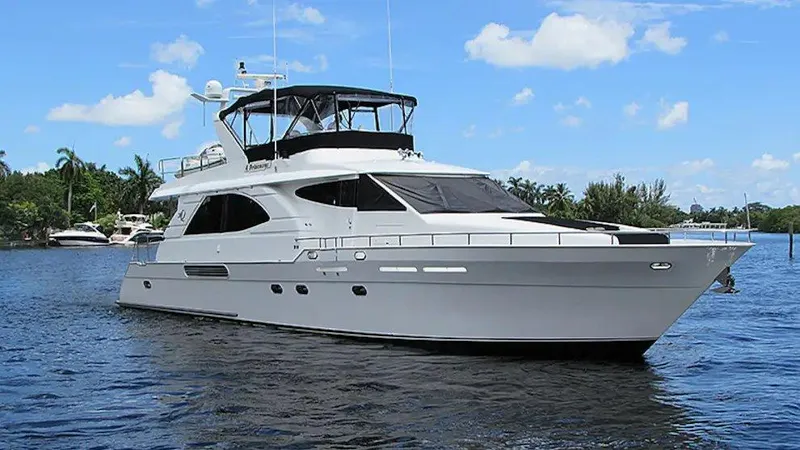 The Image of Queenship 70 Baretta 2002 yacht on calm water under blue sky. - 0