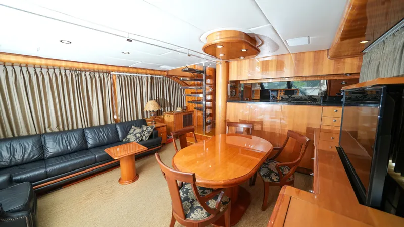 Slide: The Image of Luxurious interior of 2002 Queenship 70 Baretta yacht with elegant wood furnishings. - 10