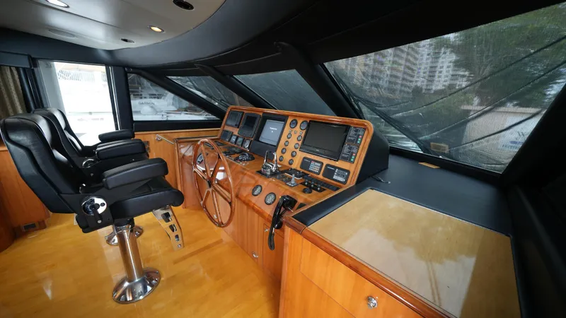 Slide: The Image of Interior helm of 2002 Queenship 70 Baretta yacht with modern navigation equipment. - 5