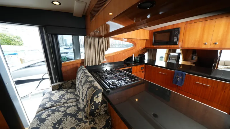 Slide: The Image of Luxurious kitchen interior of 2002 Queenship 70 Baretta yacht with modern appliances. - 7