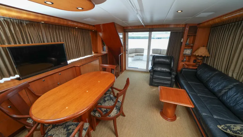 Slide: The Image of Luxurious interior of 2002 Queenship 70 Baretta yacht with elegant wood furnishings. - 9