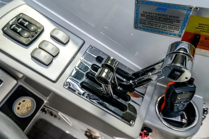 Slide: The Image of Control panel of a 2008 Formula 310 Sun Sport boat with throttle and switches. - 10