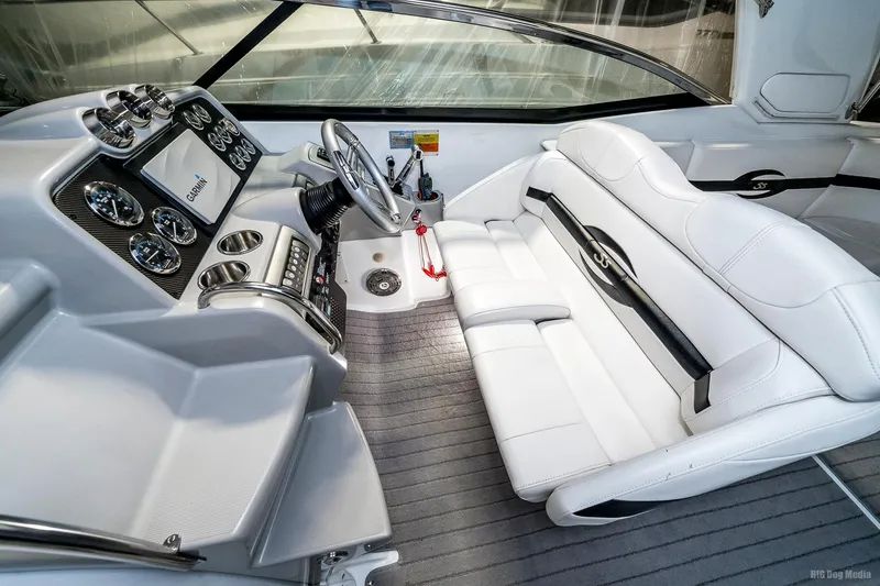 Slide: The Image of 2008 Formula 310 Sun Sport boat interior with white leather seats and modern dashboard. - 11