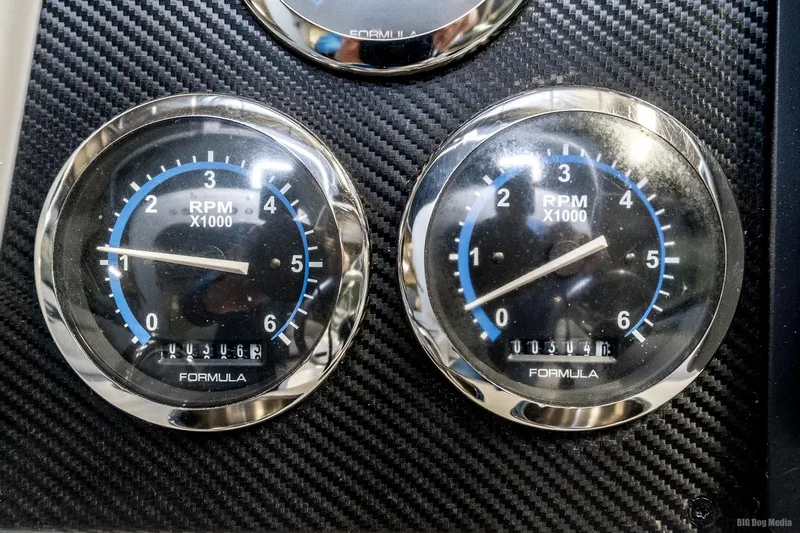 Slide: The Image of Close-up of 2008 Formula 310 Sun Sport RPM gauges on carbon fiber dashboard. - 13