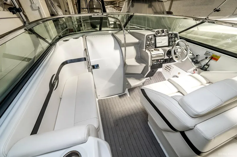 Slide: The Image of 2008 Formula 310 Sun Sport boat interior with white seating and modern dashboard. - 19
