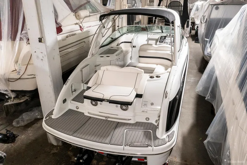 Slide: The Image of 2008 Formula 310 Sun Sport boat in storage, featuring sleek design and spacious seating. - 2