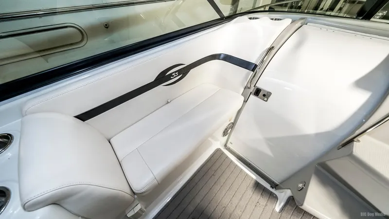 Slide: The Image of 2008 Formula 310 Sun Sport boat interior seating area with white upholstery. - 21