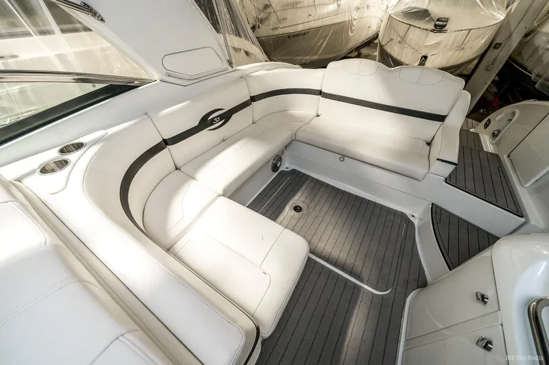 Slide: The Image of 2008 Formula 310 Sun Sport boat interior with white seating and grey flooring. - 22