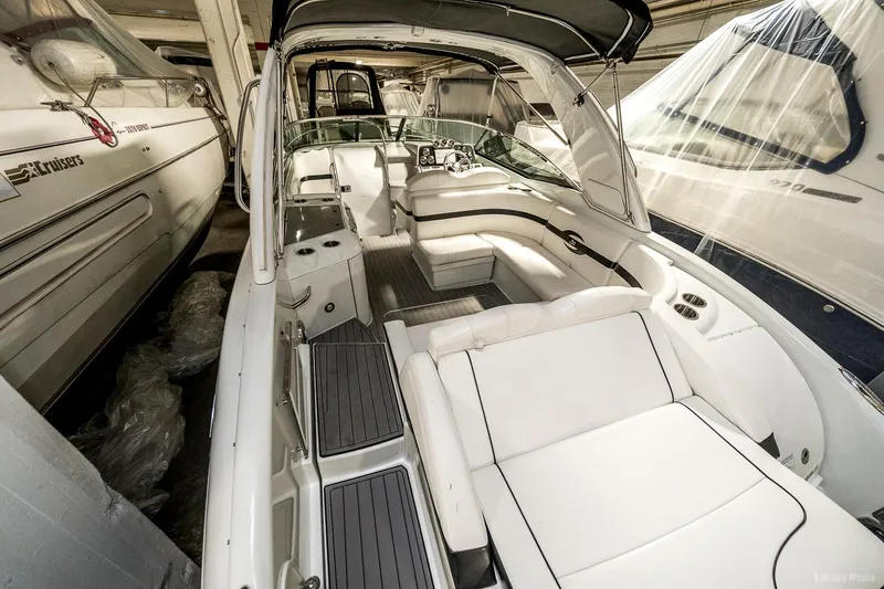 Slide: The Image of 2008 Formula 310 Sun Sport boat interior with white seating and modern dashboard. - 26