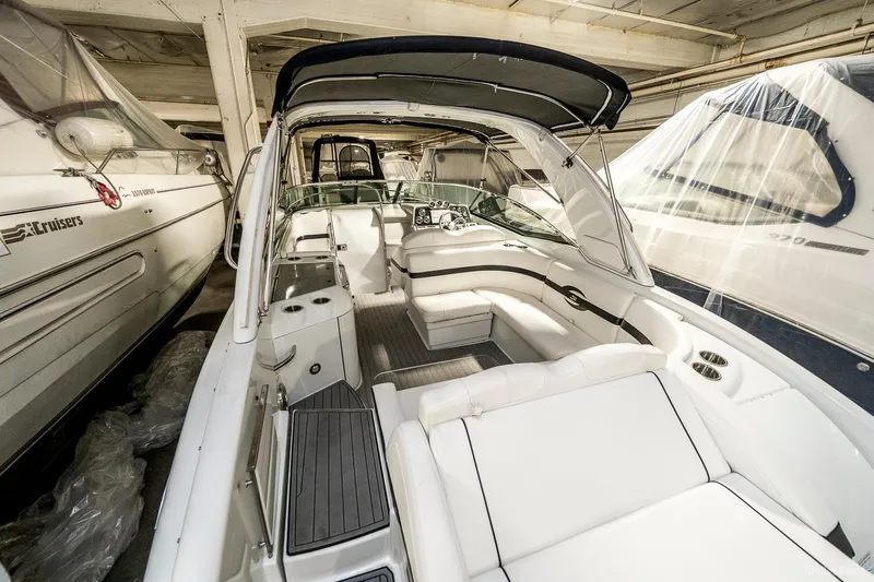 Slide: The Image of 2008 Formula 310 Sun Sport boat interior with white seating and covered cockpit. - 27