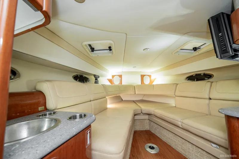 Slide: The Image of Interior of a 2008 Formula 310 Sun Sport boat with beige seating and modern amenities. - 3