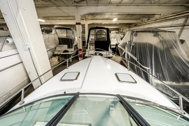 Slide: The Image of 2008 Formula 310 Sun Sport boat stored indoors with other covered boats. - 31