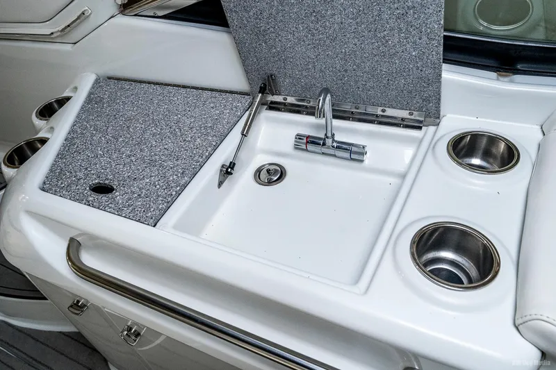 Slide: The Image of 2008 Formula 310 Sun Sport boat sink and countertop with cup holders. - 32