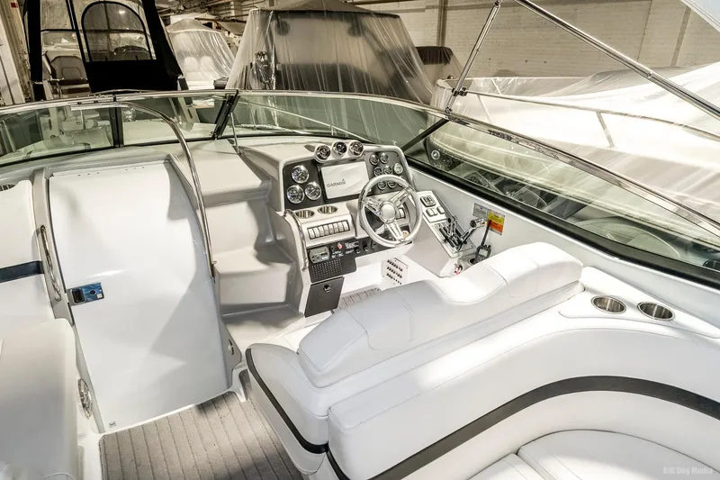Slide: The Image of 2008 Formula 310 Sun Sport boat interior with white leather seating and modern dashboard. - 35