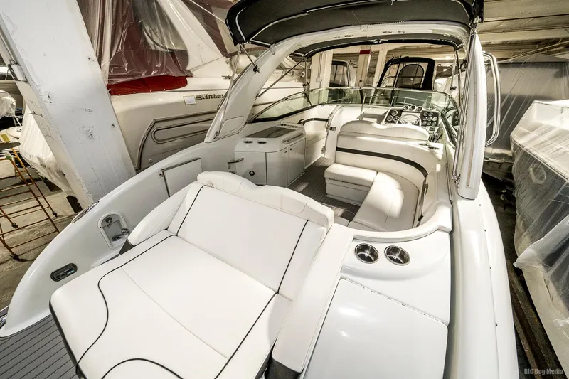 Slide: The Image of 2008 Formula 310 Sun Sport boat interior with white seating and dashboard. - 37