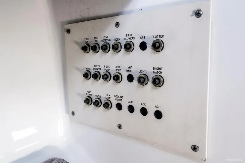 Slide: The Image of Control panel of a 2008 Formula 310 Sun Sport boat with labeled switches. - 42