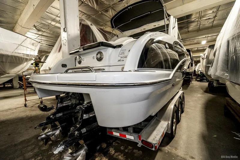 Slide: The Image of 2008 Formula 310 Sun Sport boat on a trailer in an indoor storage facility. - 49