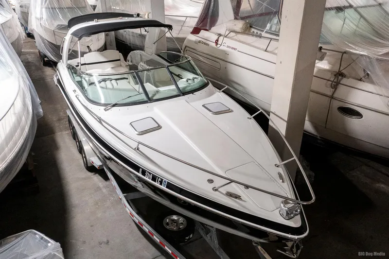 Slide: The Image of 2008 Formula 310 Sun Sport boat in indoor storage, on a trailer. - 5