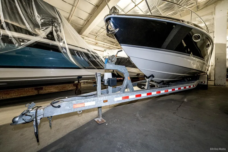 Slide: The Image of 2008 Formula 310 Sun Sport boat on a trailer in a storage facility. - 50