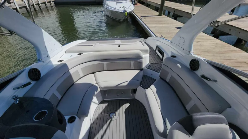 Slide: The Image of 2018 Rinker QX 26 boat interior with spacious seating and modern design. - 27