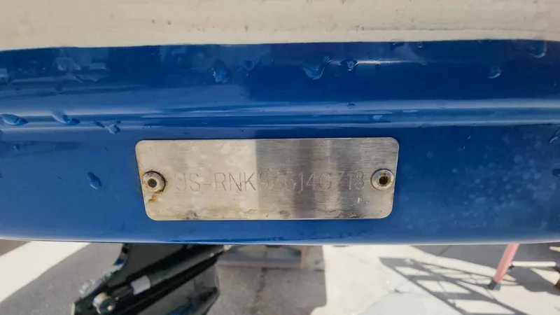 Slide: The Image of 2018 Rinker QX 26 boat hull identification number plate. - 38