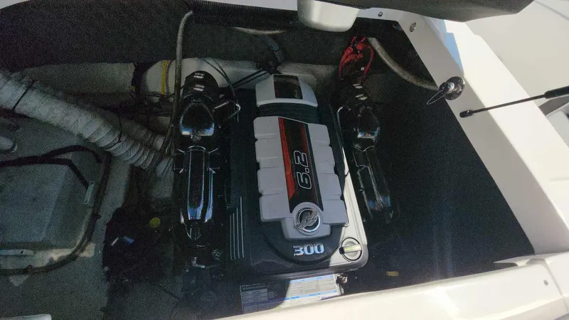 Slide: The Image of 2018 Rinker QX 26 boat engine compartment with 6.2L 300 HP engine. - 43