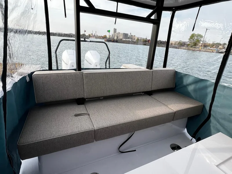 Slide: The Image of 2024 Axopar 37 Sun Top Mediterrana Edition boat interior with cushioned seating. - 13