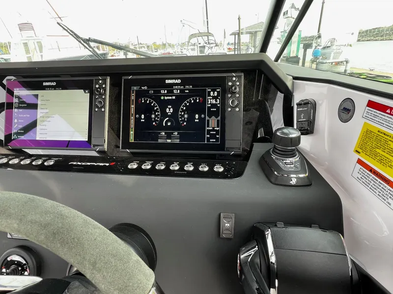 Slide: The Image of 2024 Axopar 37 Sun Top Mediterrana Edition dashboard with advanced navigation displays. - 19